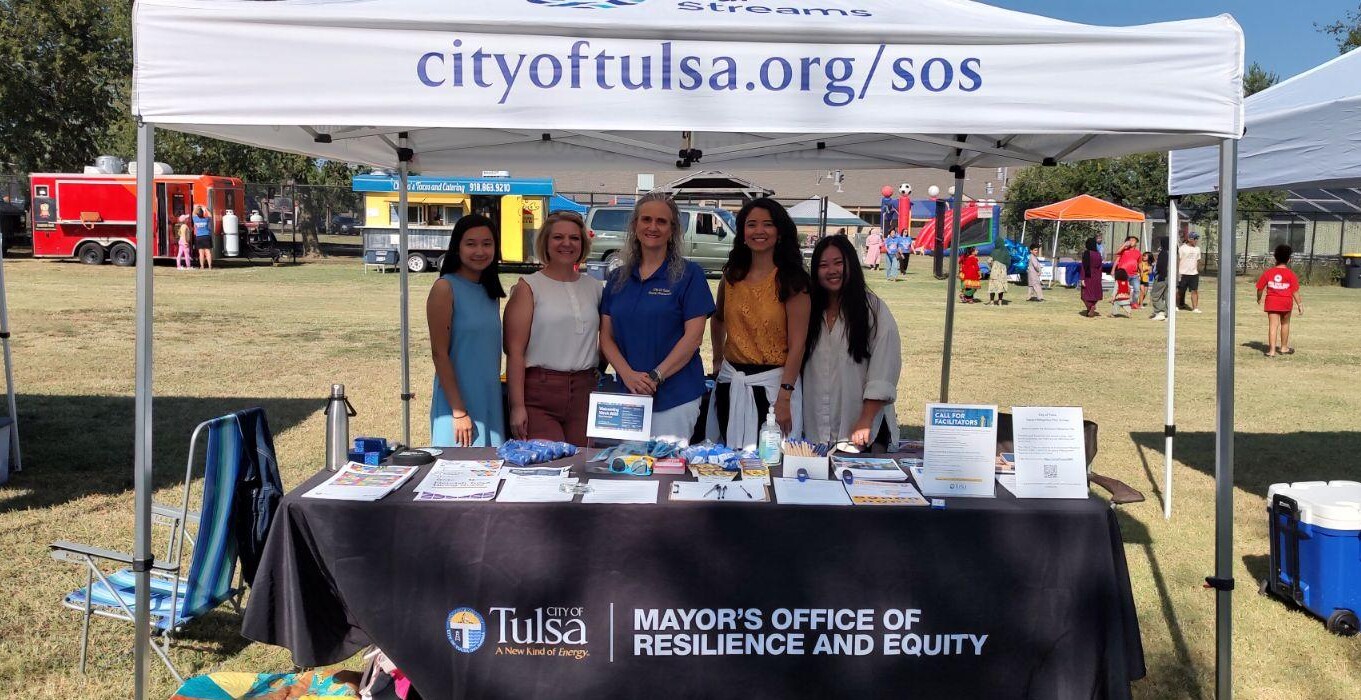 Employees at the City of Tulsa stand at a booth at their 2023 Welcoming Week Festival